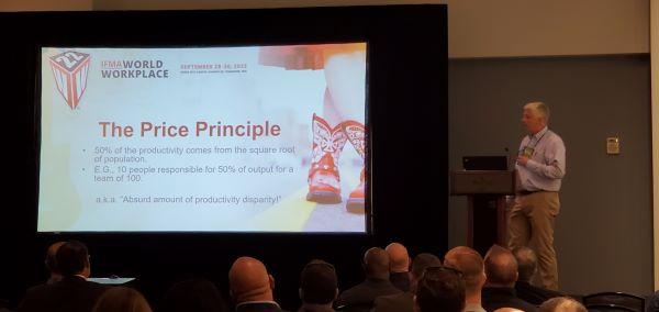 A man giving a presentation on the price principle.