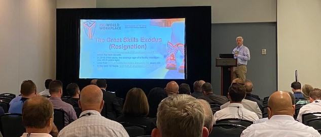 A man giving a presentation at a conference.
