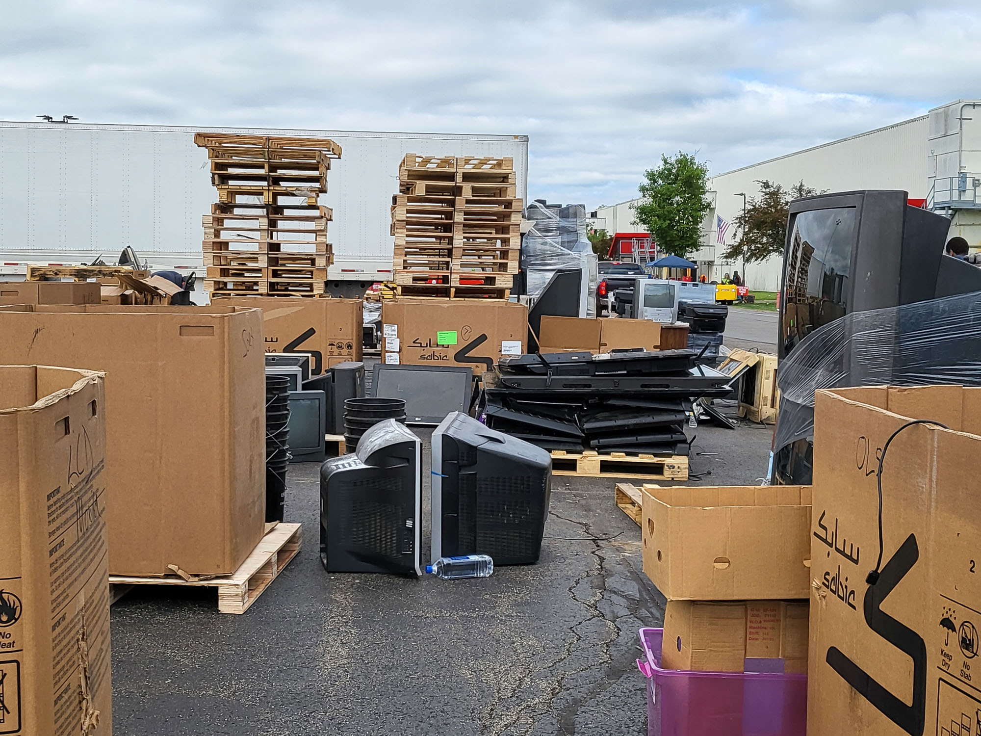 A lot of boxes in a parking lot.