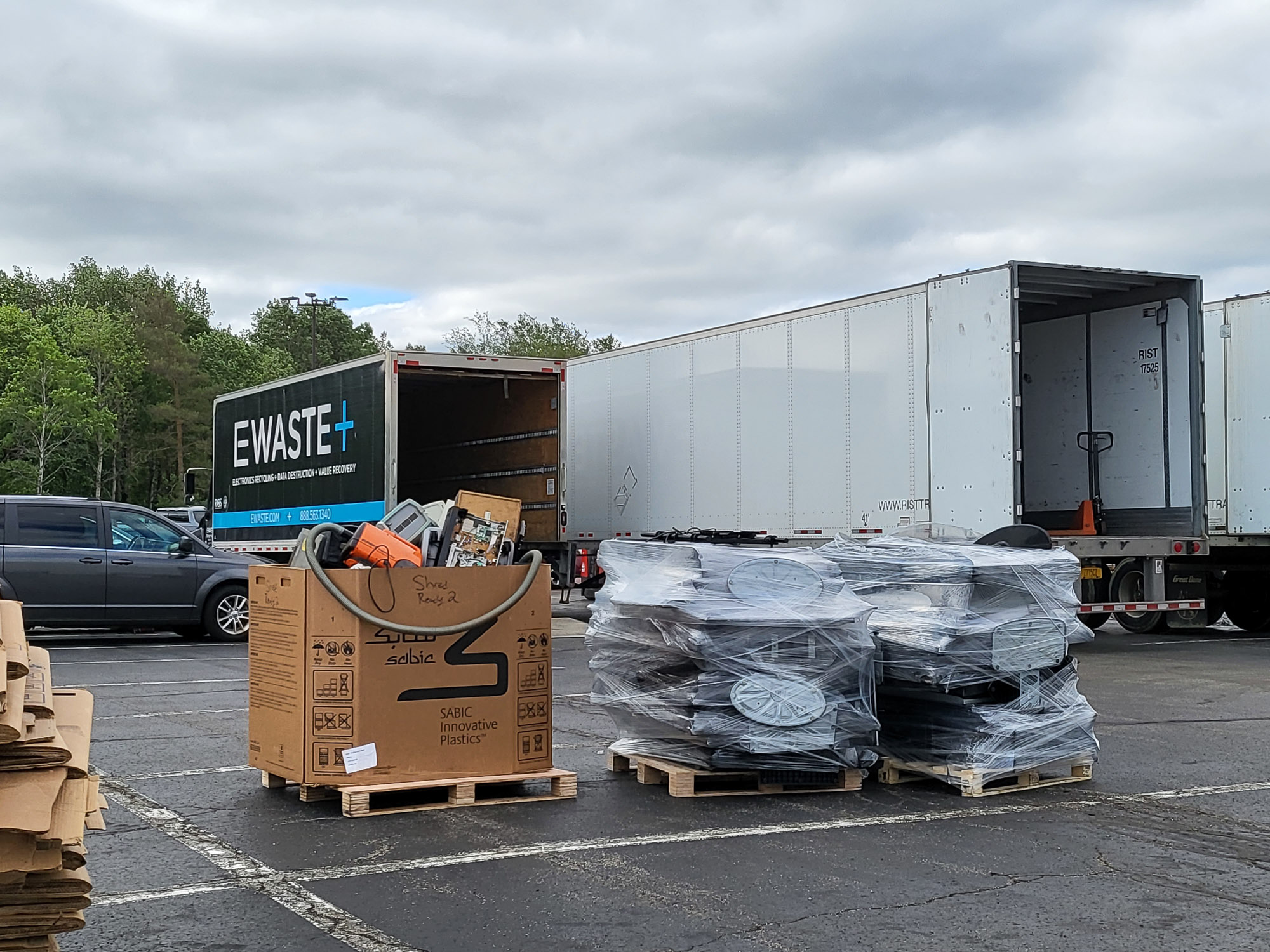 A truck is parked in a parking lot with boxes.