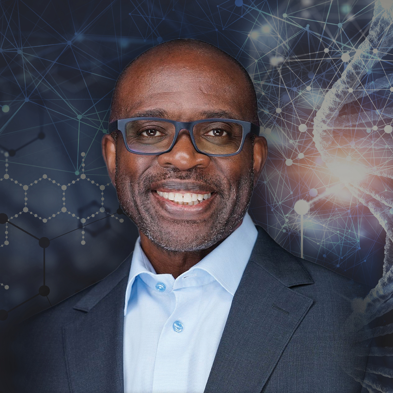 A man in glasses is smiling in front of a dna background.