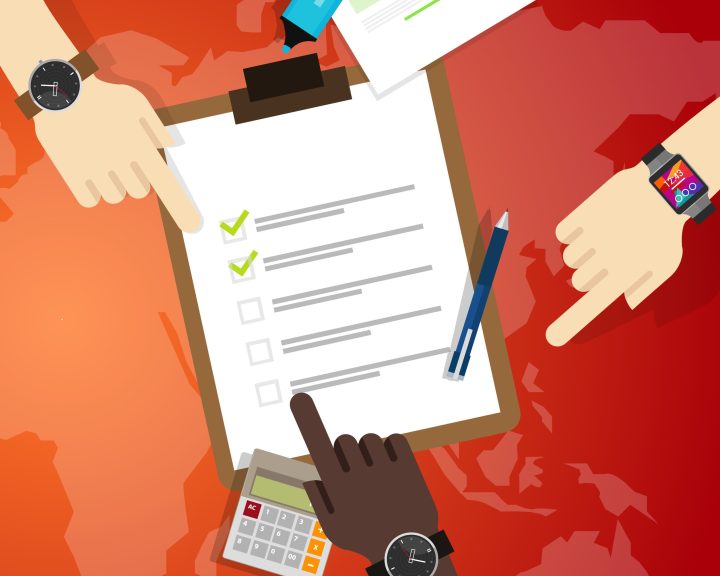 People pointing at a clipboard with a checklist, pen, graphs, and a calculator