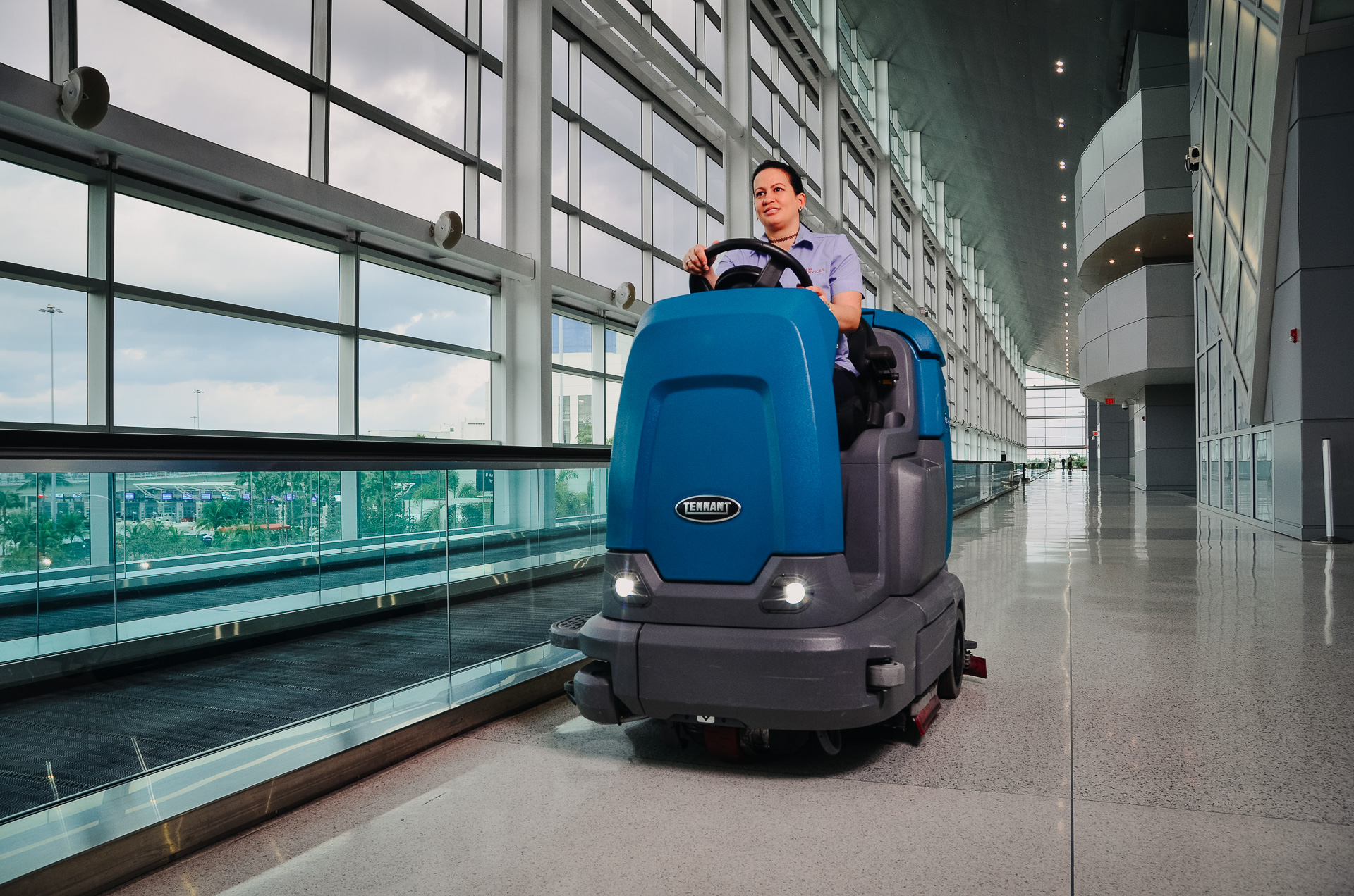 A woman driving a machine.
