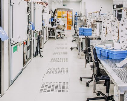 A laboratory with a row of desk and chairs