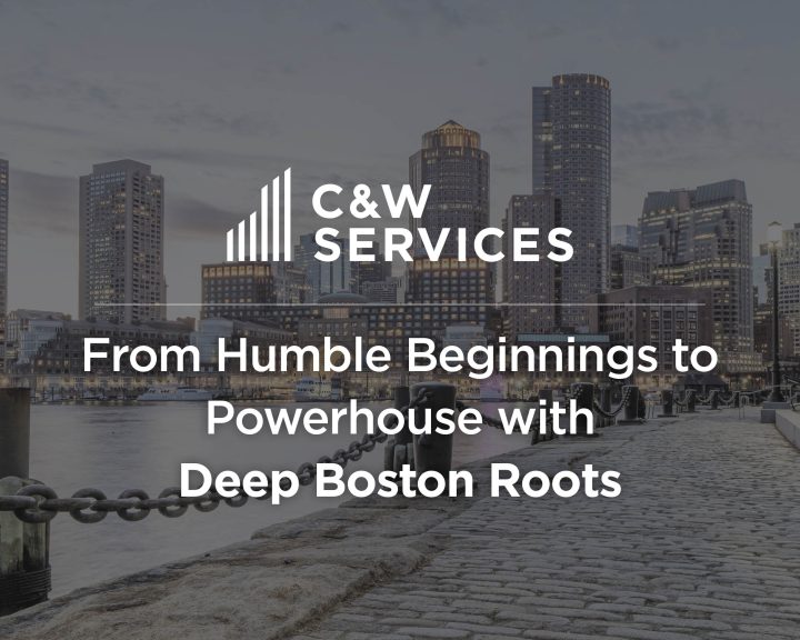 C&W Services text overlay on an image of a Boston waterfront with cobblestones, buildings, and a chain railing. The text reads: 