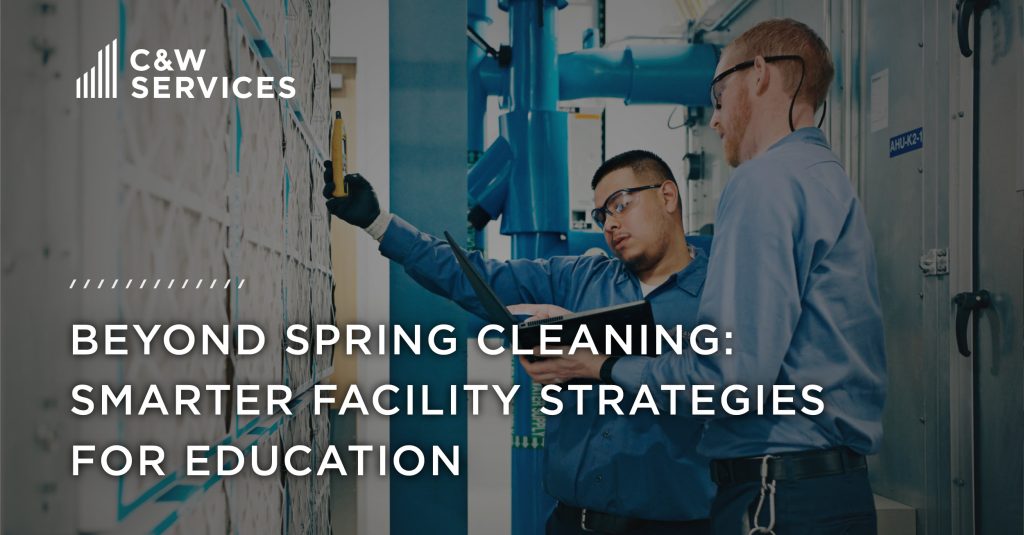 Two workers in blue shirts inspect facility machinery. Text: "C&W Services. Beyond Spring Cleaning: Smarter Facility Strategies for Education.